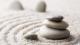 A pile of zen stones on sand
