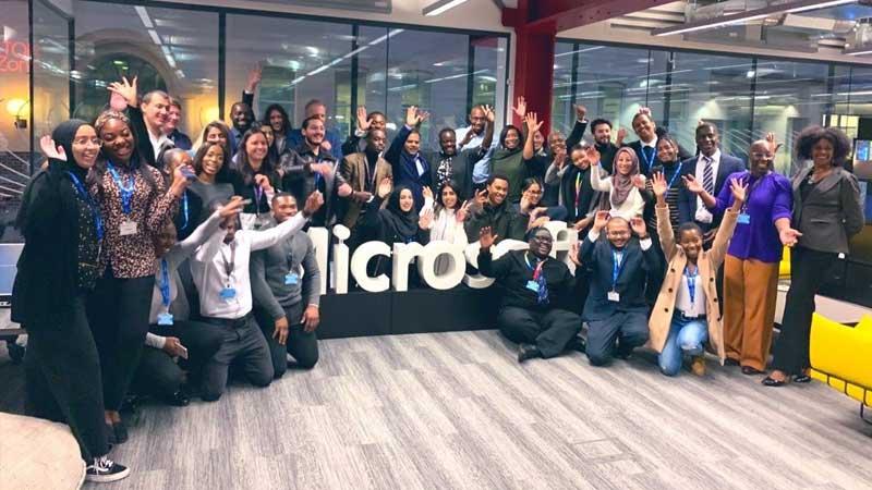 Group-cheering-by-Microsoft-sign