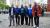 School of Management and Marketing course leaders and colleagues standing in front of the Tower of London.