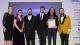 Linsey Cole, an alumni representative, a student representative and Professor Dibyesh Anand stand with representatives from the KCW Business Awards team in front of a screen that reads HIGHLY COMMENDED. Professor Anand holds Westminster's certificate. 