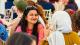 Woman sitting in crowd