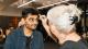 Attendee having his face painted in the traditional Day of the Dead style.