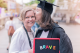 graduate student kisses parent