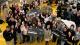 Group photo of participants in Stradling competition, with winners holding large cardboard cheques.