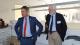 Peter Bonfield and Richard Burge smiling at something out of view during Richard's tour of Westminster Business School.