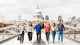 A group of students walking on bridge with St Paul's Cathedral in the background 