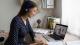 Woman attending a virtual lesson with a laptop