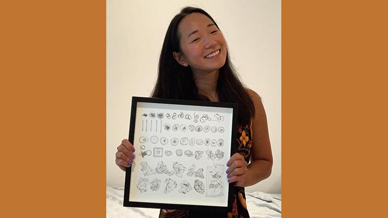 Picture of Jolene Liam Alumna, holding her drawing titled 'Taking Out the Trash'