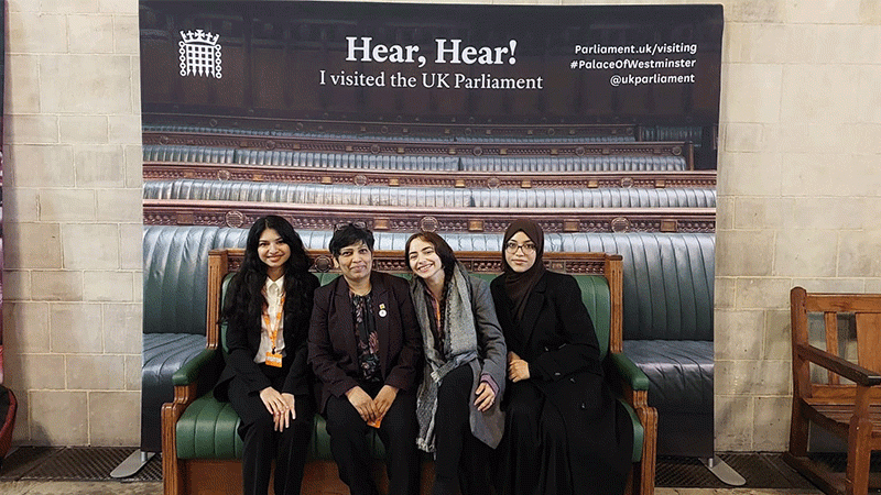 Posters in Parliament group photo