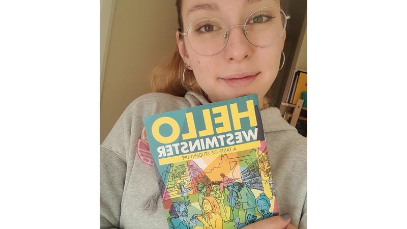 Photo of Illustration and Visual Communication student Roberta Shavenko holding Hello Westminster magazine
