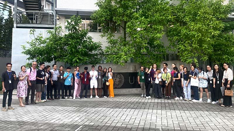 Westminster and Hanoi university students pictured in front of UN building in Vietnam field trip