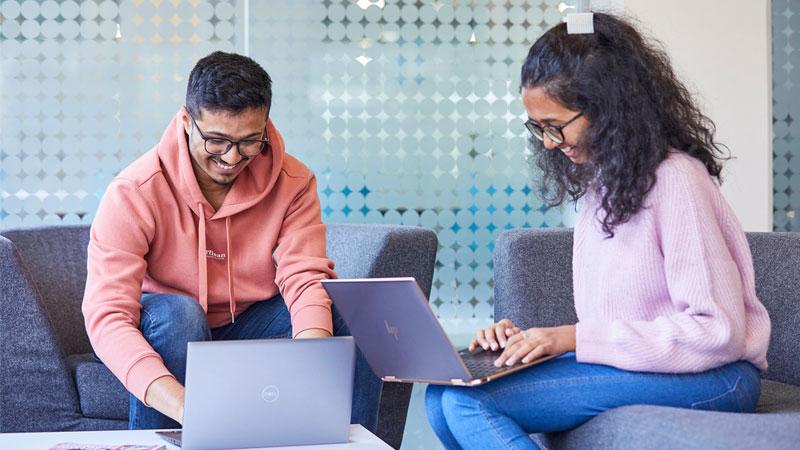 Two students using laptops