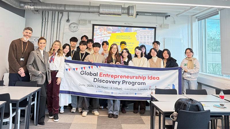 Photo of the South Korean delegation with members of the Westminster team holding a banner which reads Global Entrepreneurship Idea Discovery Programme