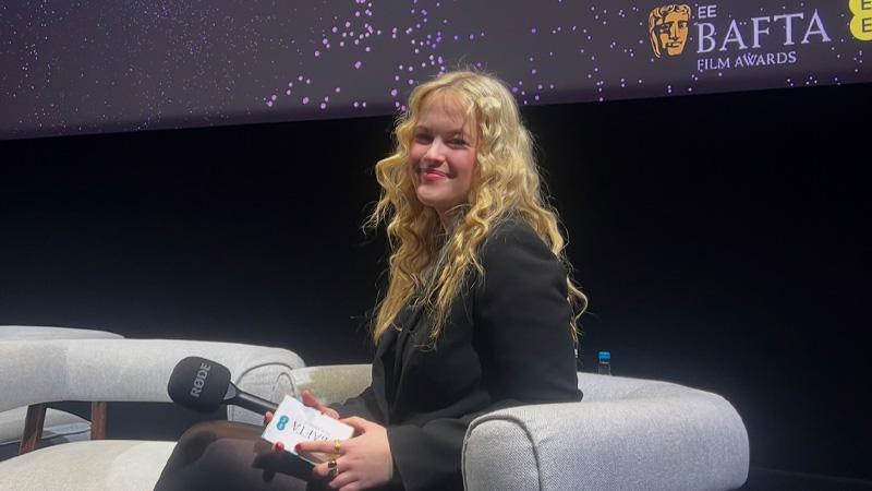 Sophie Keeble sat in a chair with a microphone.